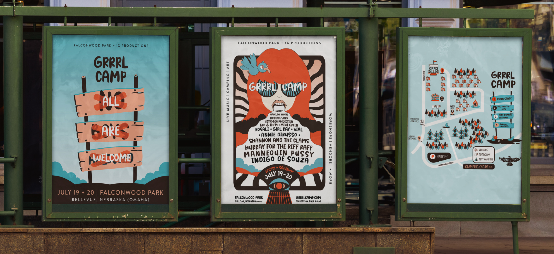 Grrrl Camp 2024 outdoor poster display with three framed festival posters on a green kiosk